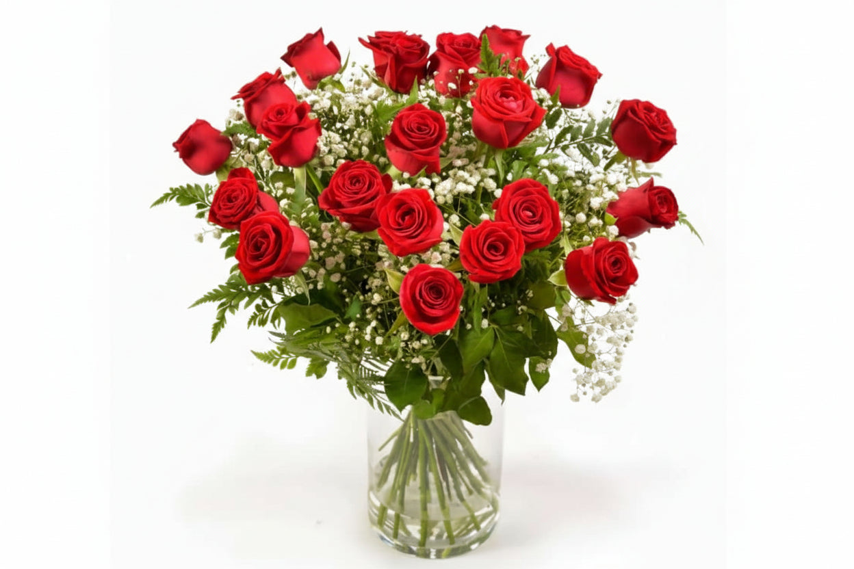 Bouquet of red roses with a clear vase on a white background